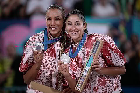 Paris Olympics Women's beach volleyball: Canada's Brandie Wilkerson, left, and Melissa Humana-Paredes pose with their silver medals